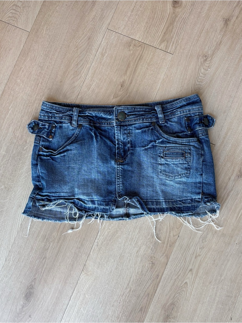 low rise y2k denim mini skirt with frayed hem, skull details (Farlow Jeans)